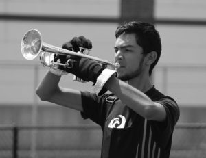 Trumpet player Albert Escobedo said he believes that being in a drum corps is just as much of a sport as football or basketball. Many times, their training days are 12 hours long with 4-hour block periods. Escobito said they also wake up each morning and do 45 minutes of physical training, â€œI would definitely consider it a sport. If you take into account all the training and preparation that needs to be accounted for moving in." Photo by Kayla Ebner kayla3976@yahoo.com