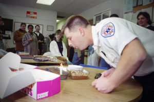 Bob Audet celebrates his birthday with the Syracuse University Ambulance crowd in 1997. Photo by Bradley Wilson