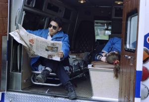 David Flores and his partner relax on a standby with Syracuse University EMS in 1996. Photo Â© by Bradley Wilson